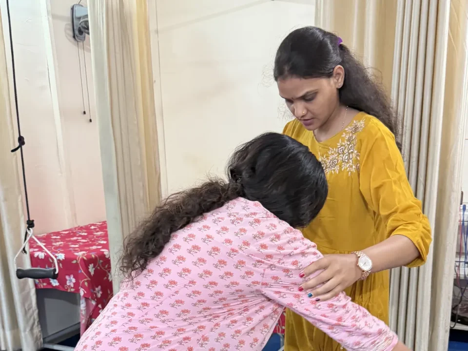 Female physiotherapist Dr. Suman Choudhary treating a back pain patient at UR Physio Clinic, Murlipura, Jaipur
